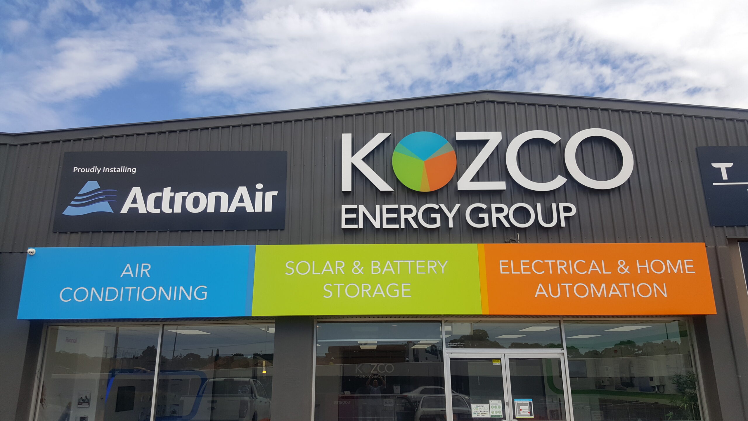 custom printed metal signs installed on front fascia of business Adelaide