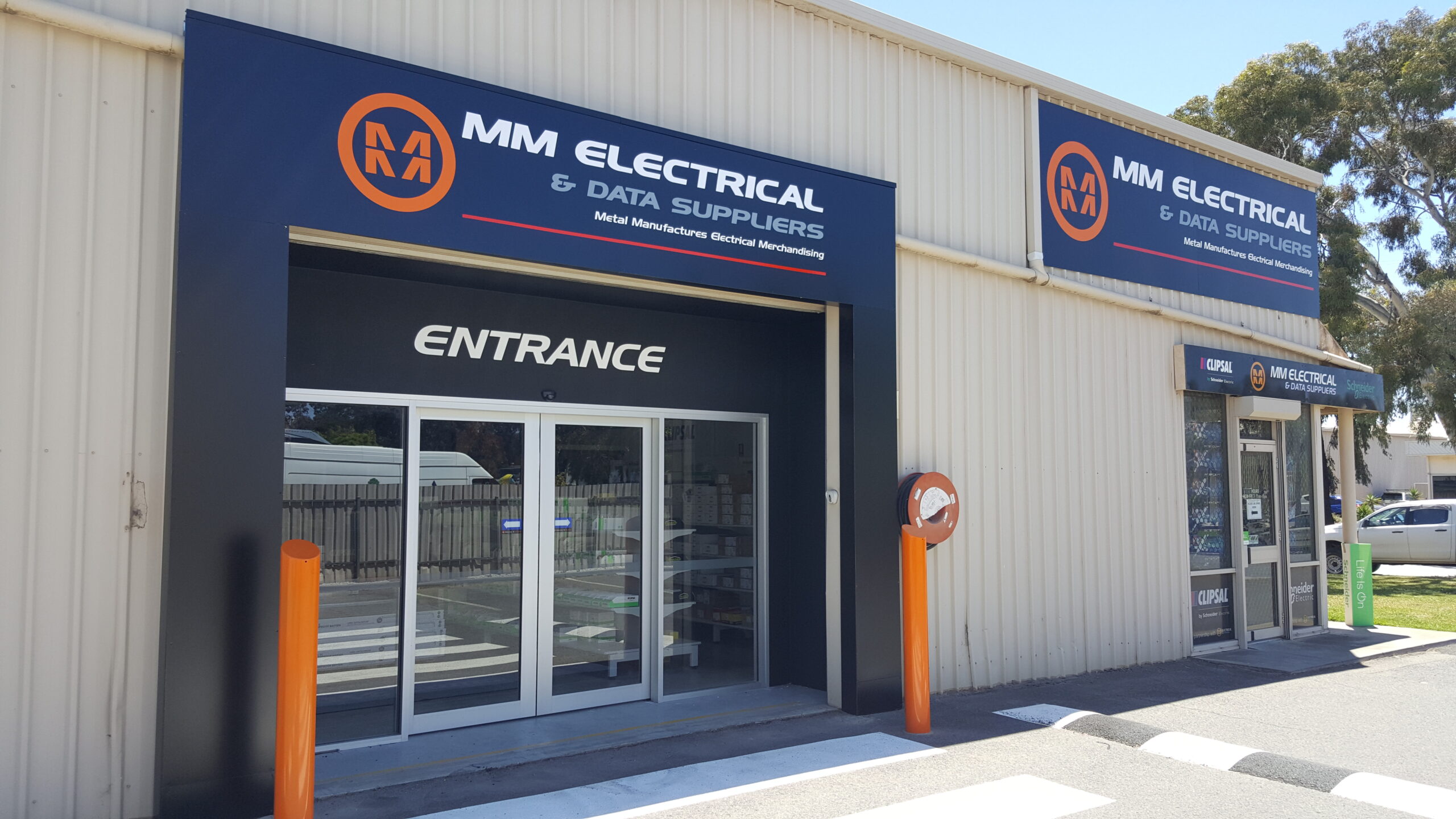 custom outdoor building signs installed on fascia Adelaide