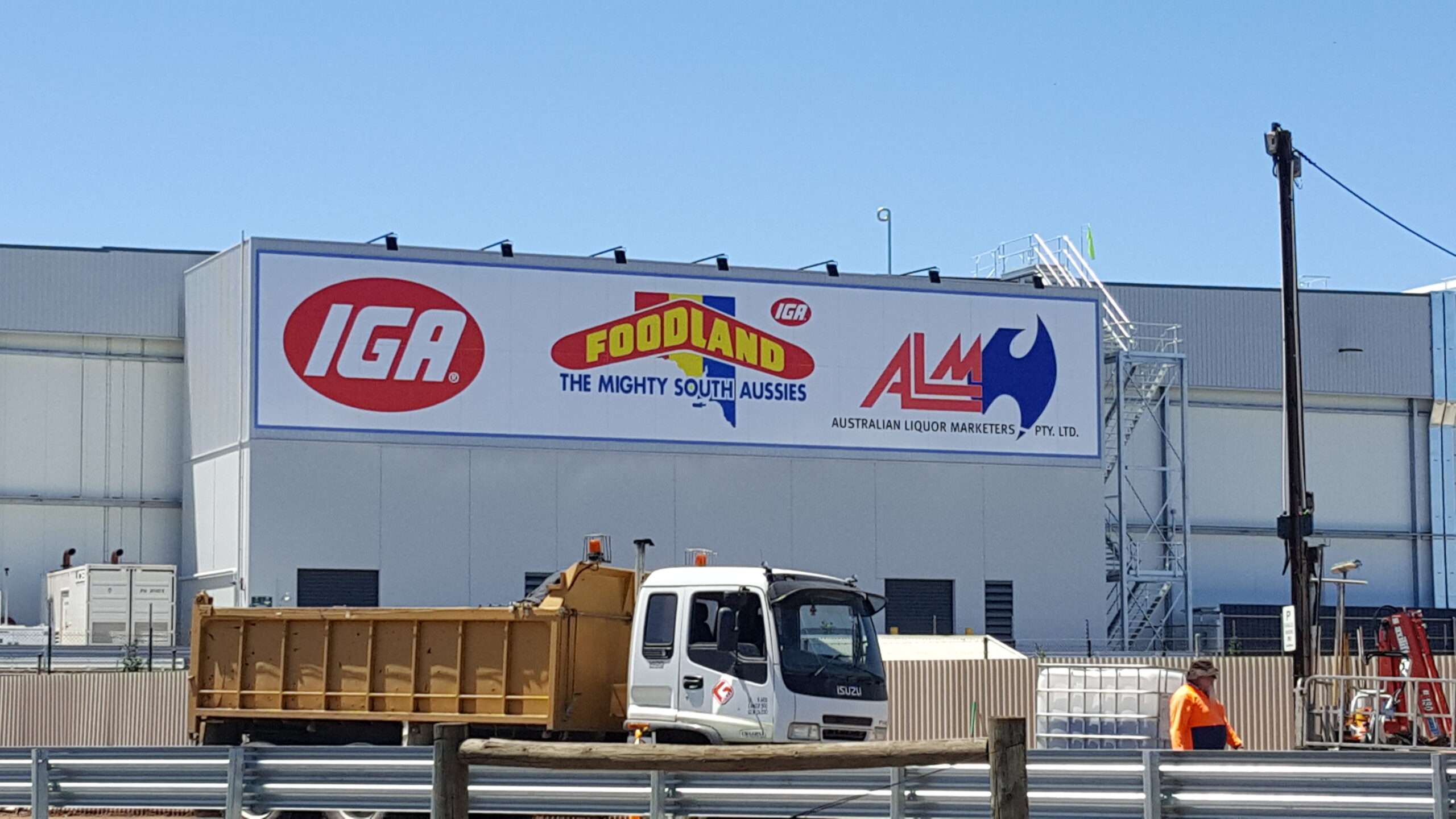 large format outdoor business sign on building fascia in Adelaide